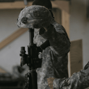 Everyday is Memorial Day. A soldier places a helmet on a rifle, symbolizing respect and remembrance for fallen comrades.
