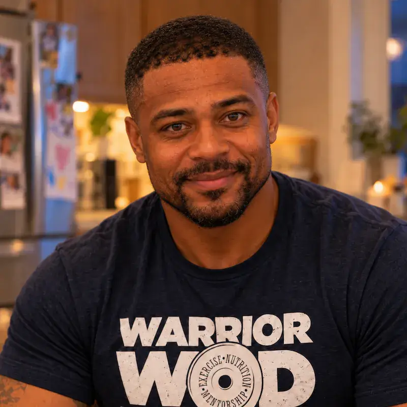 Marcus T., Army veteran and WarriorWOD Warrior Class graduate, smiling at home in a WarriorWOD shirt