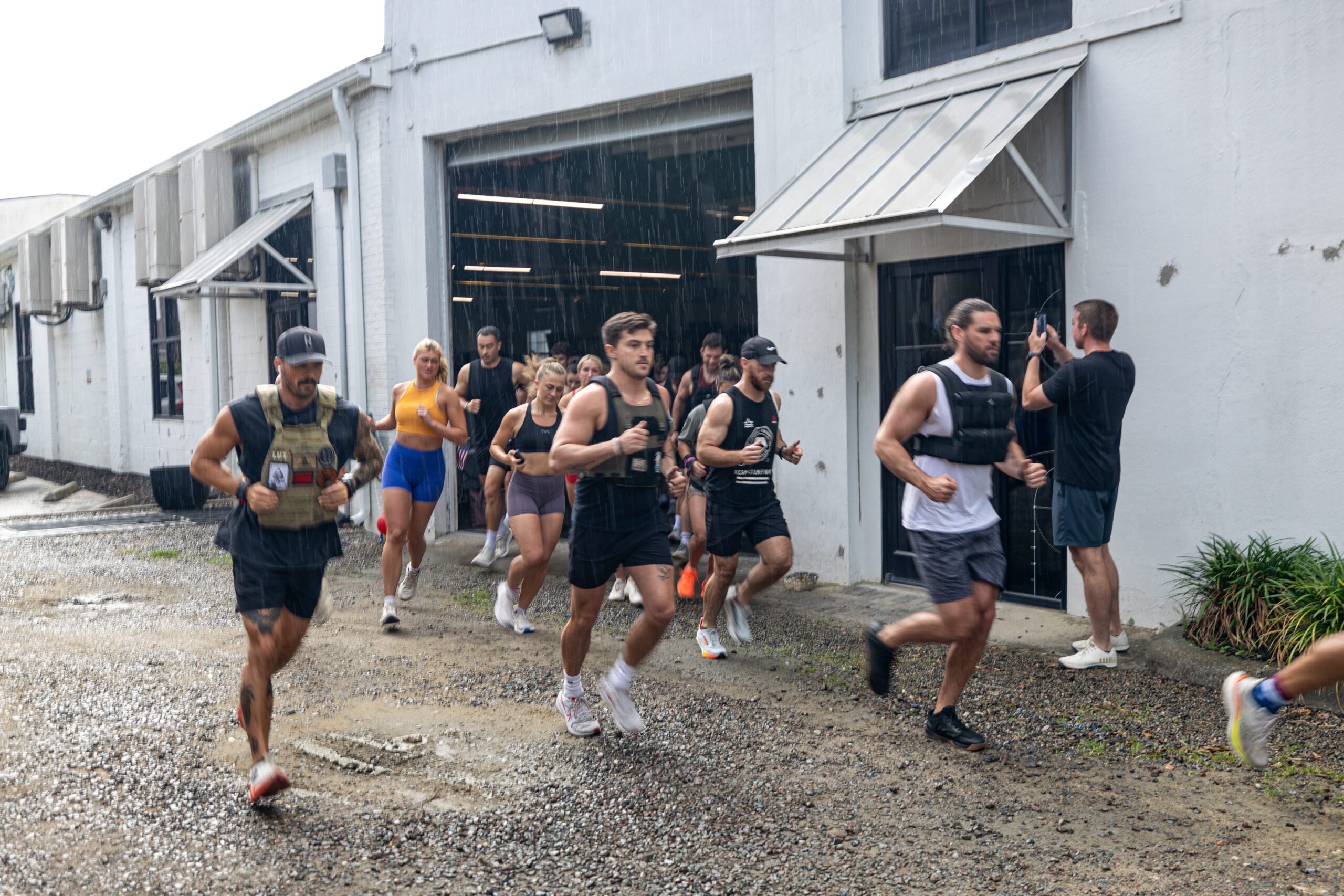 Athletes in weight vests running the first mile of the Memorial Day Murph at Ethos Athletic Club in Charleston